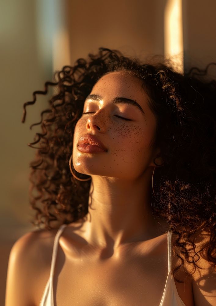 Attractive latinx woman with curly hair volumetric face neck.