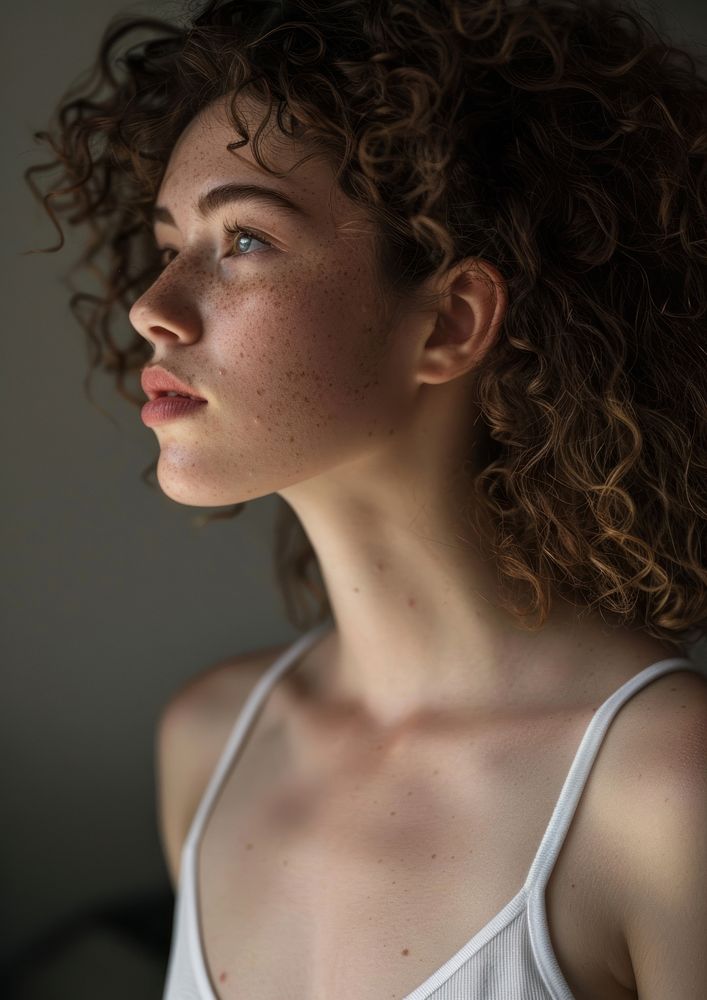 Attractive latinx woman with curly hair volumetric photography portrait.