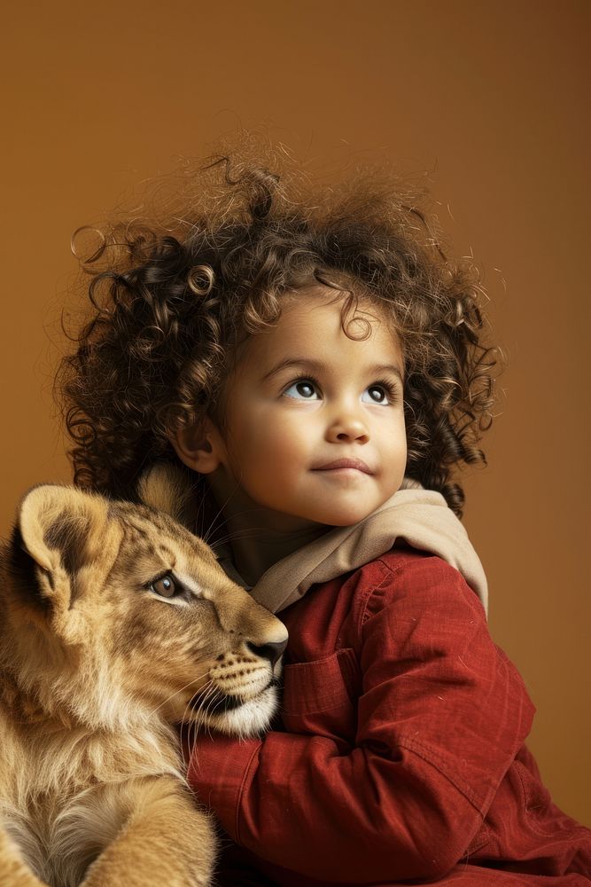 Sitting beside baby lion photo photography portrait.