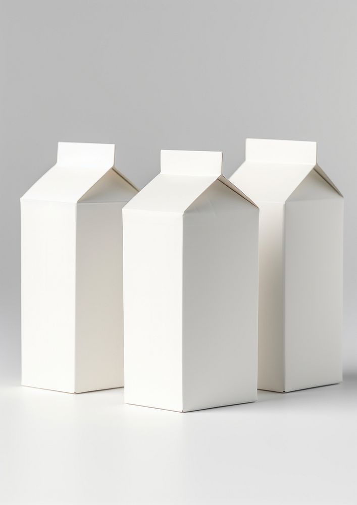 Juice or milk blank white carton boxes cardboard white background architecture.