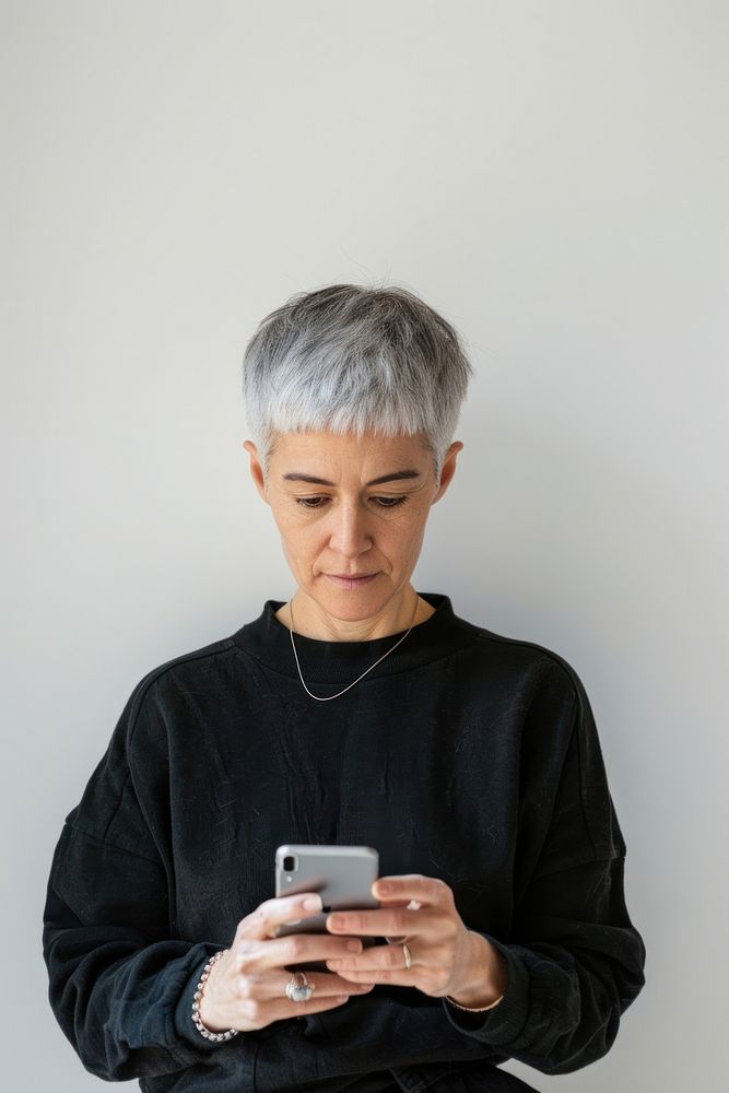 Adult playing smartphone portrait photo hair.