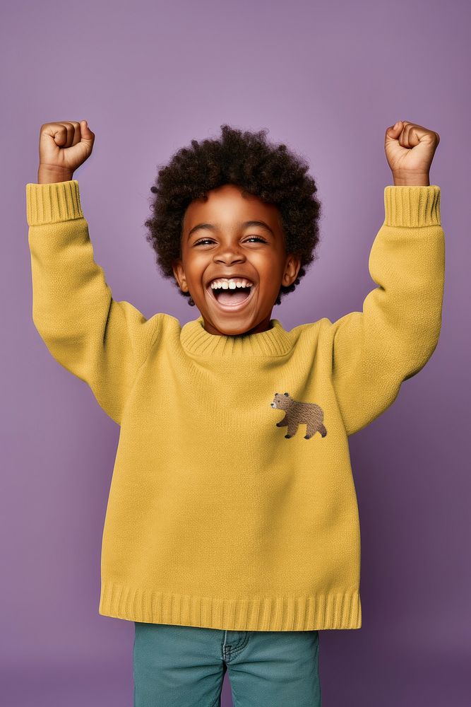 Happy African boy in mustard yellow sweater