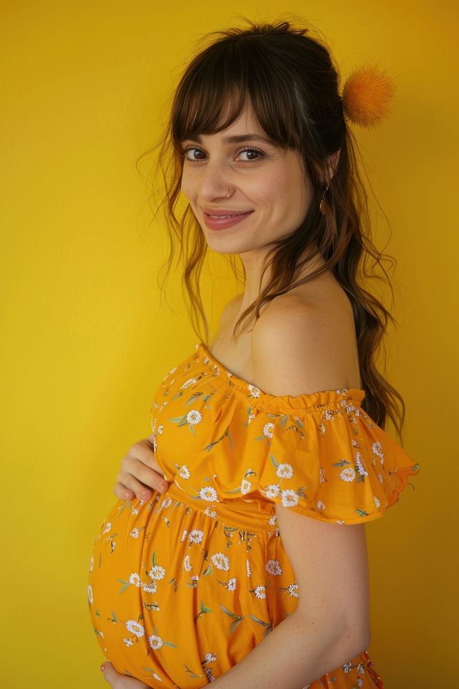 Pregnant portrait dress happy.