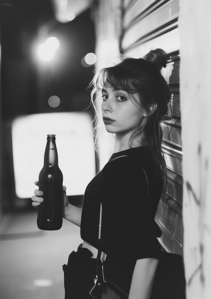 A teenage woman carry beer bottle photography accessories accessory.
