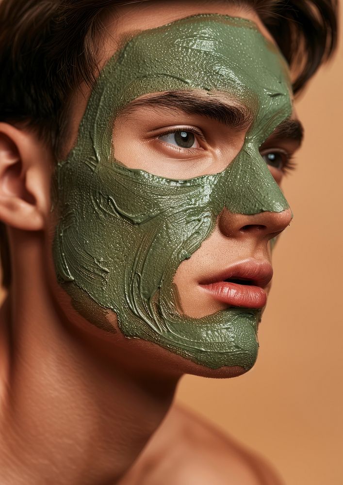 A man with a green facial mask photo photography portrait.