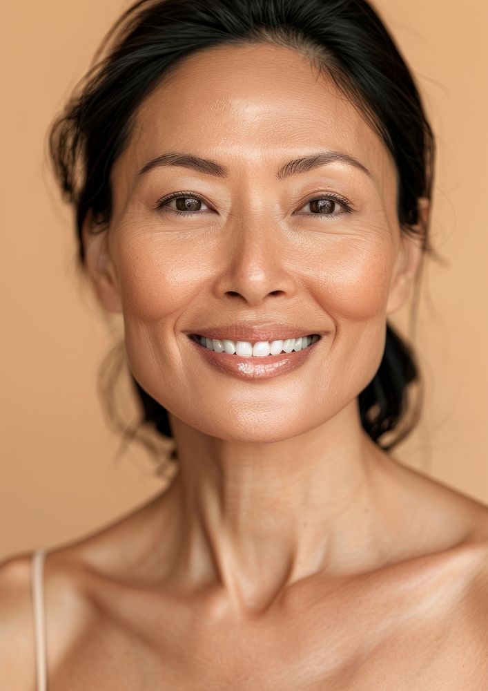 Middle age South East Asian woman happy smile skin.