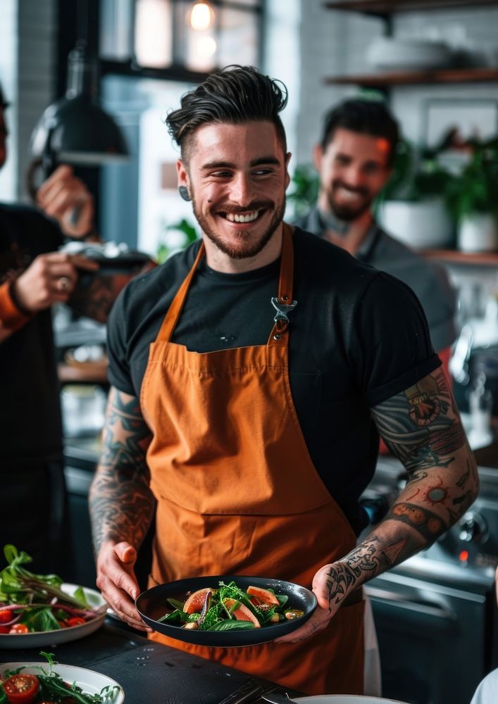 An attractive young chef tattoo person adult.