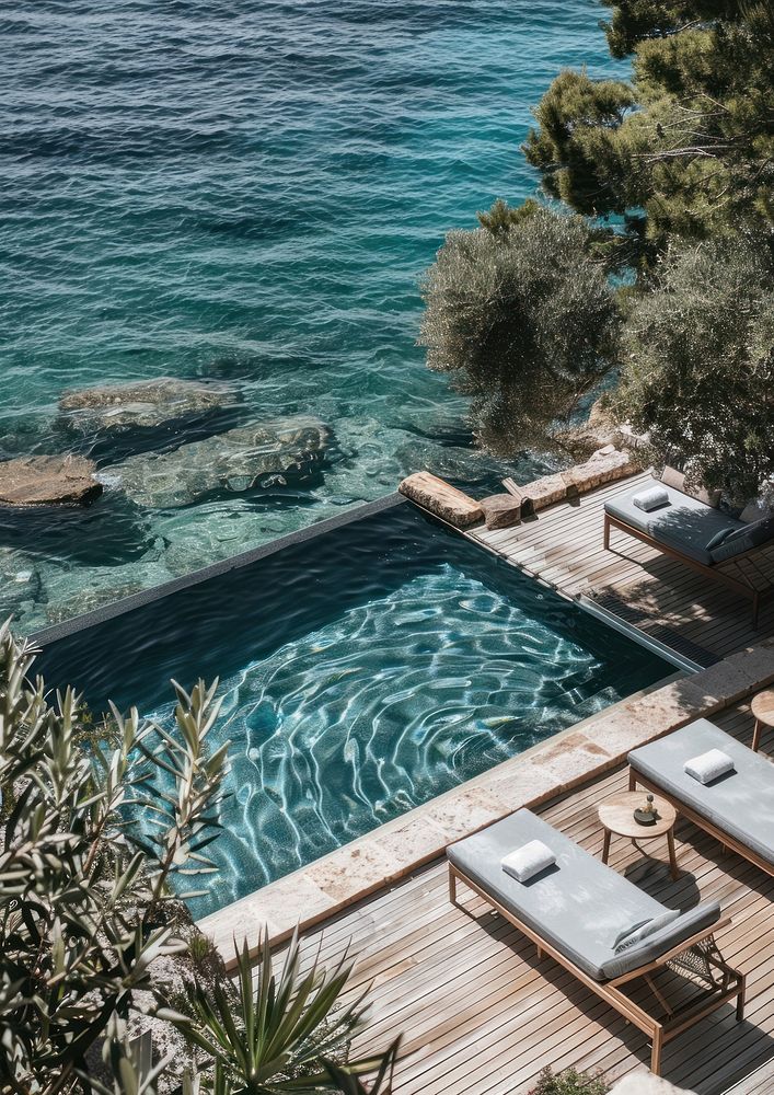 Minimalistic hotel pool outdoors furniture nature.