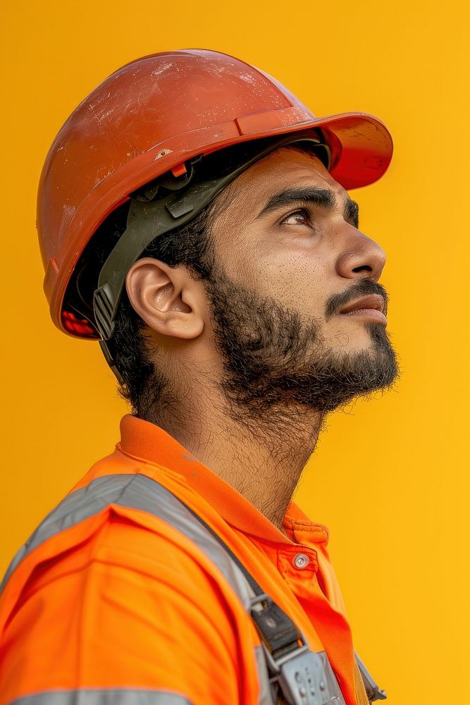 Middle eastern construction worker side portrait clothing apparel hardhat.