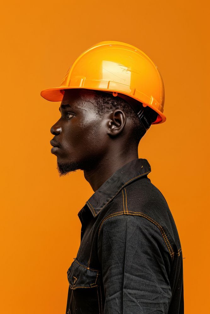 African construction worker side portrait clothing apparel hardhat.