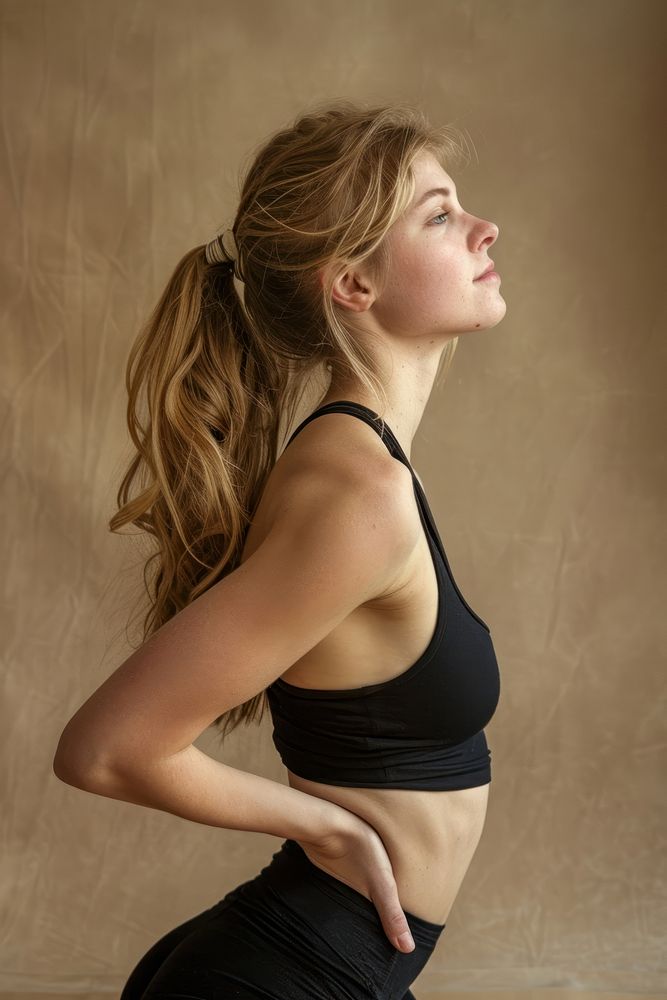 Back side of young blonde caucasian woman stretching after yoga photo photography underwear.