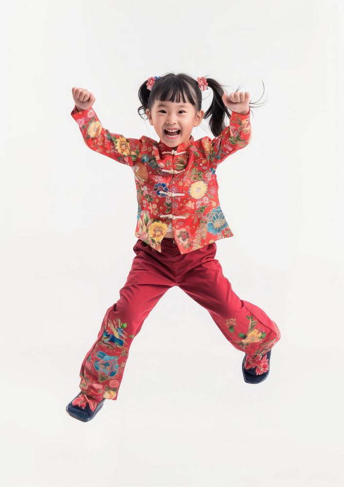 Happy smiling dancing asian girl child white background celebration.