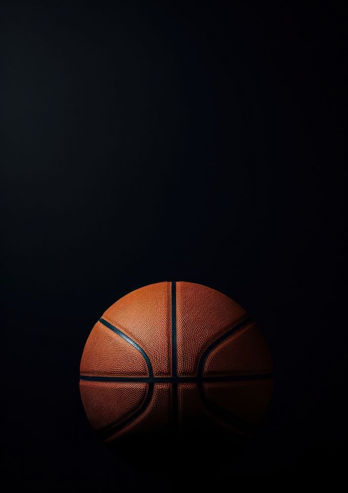 Basketball on dark background football soccer sports.
