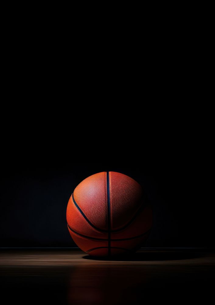 Basketball on dark background football sphere sports.