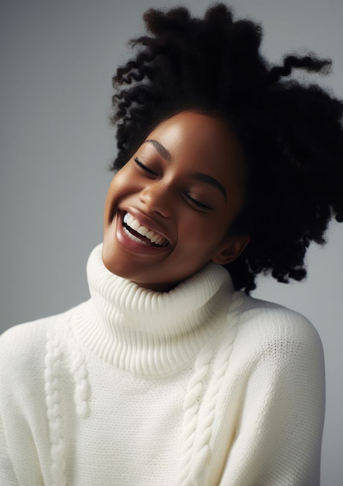 Black woman in white sweater happy laughing clothing.