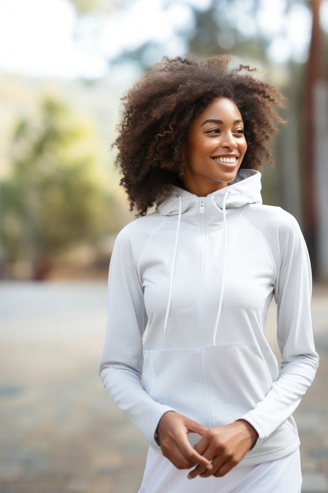 Black woman wearing white sport wear happy clothing dimples.