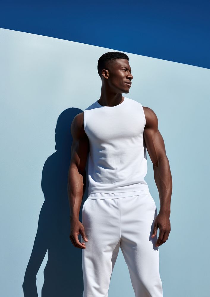 Black man in white sport wear undershirt clothing apparel.