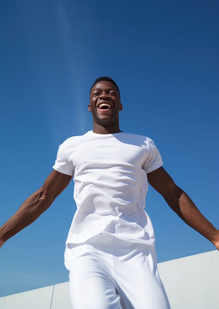 Black man in white sport wear happy laughing person.