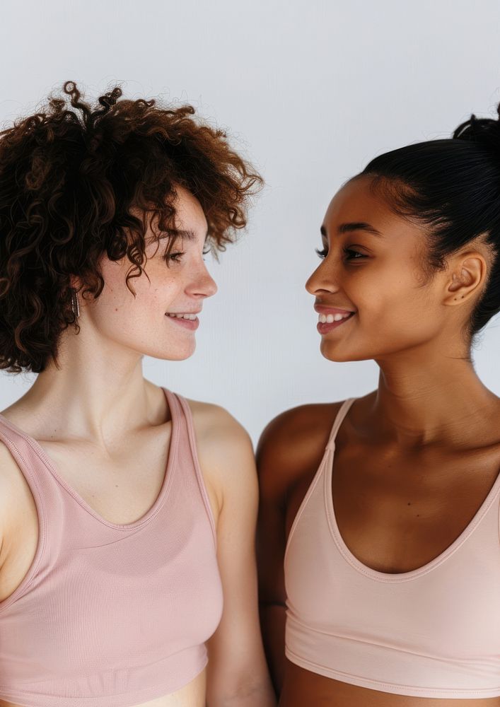2 women wearing pastel pink color sport wear happy person female.