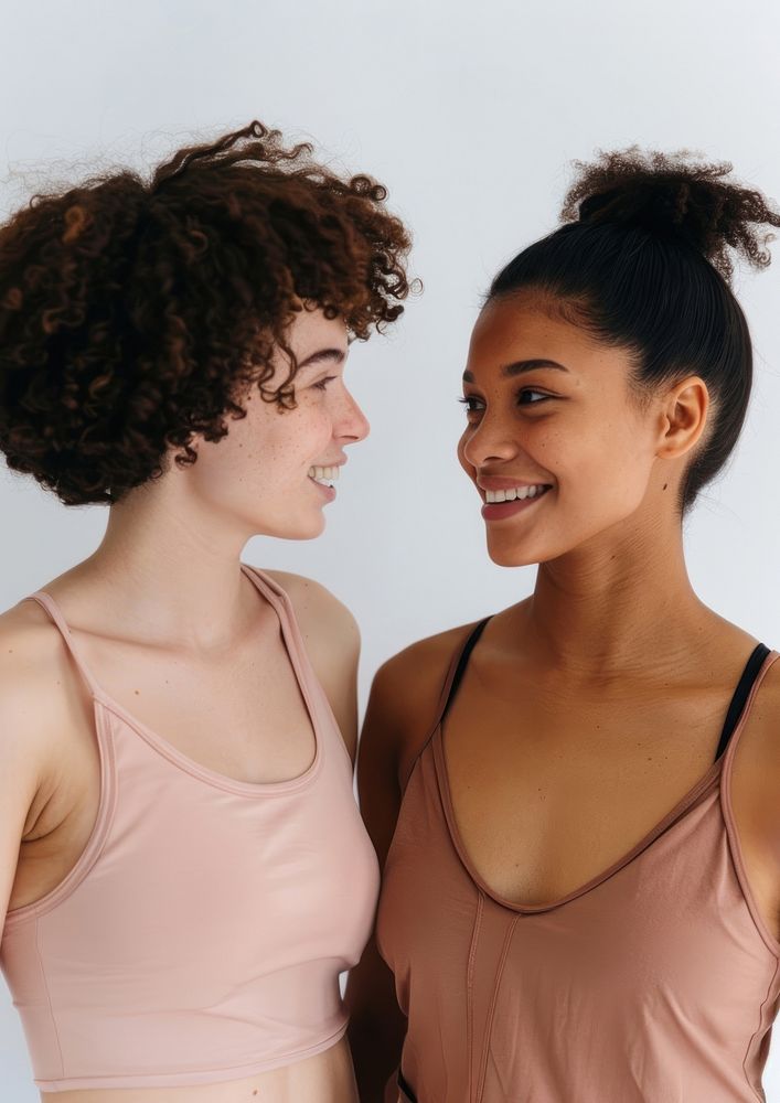 2 women wearing pastel pink color sport wear happy photo photography.