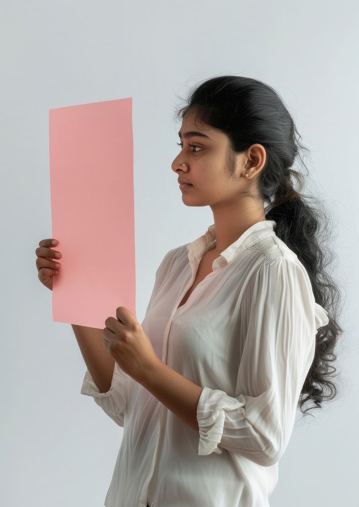 Holding a pink paper sheet photography woman portrait.