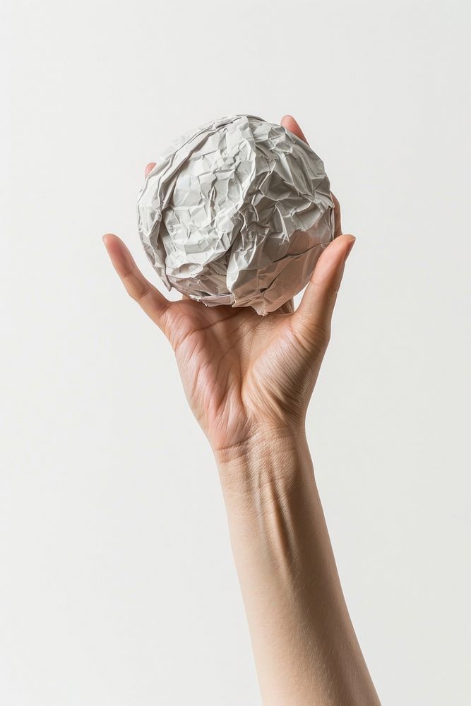 An Asian woman cradled the old crumpled paper ball accessories accessory aluminium.