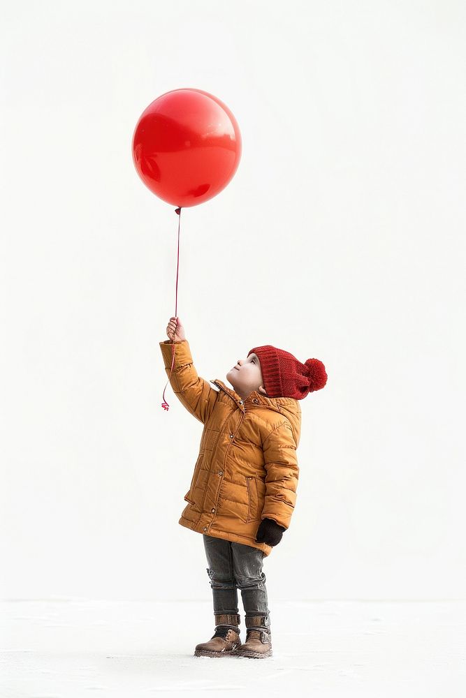 A kid holding balloon photo photography clothing.