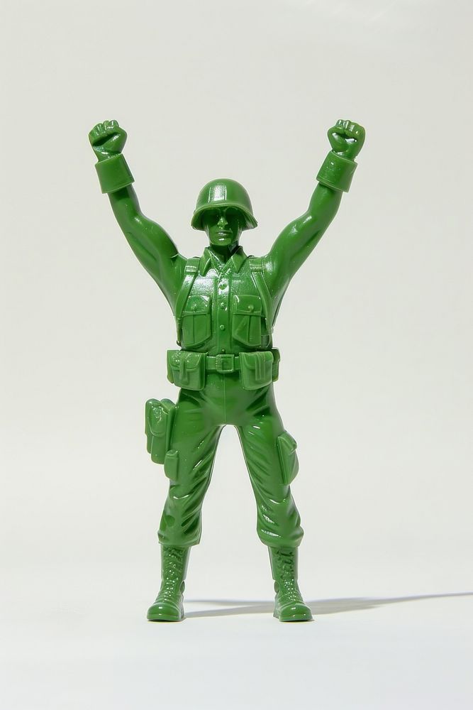Plastic toy soldier doing success green clothing footwear.