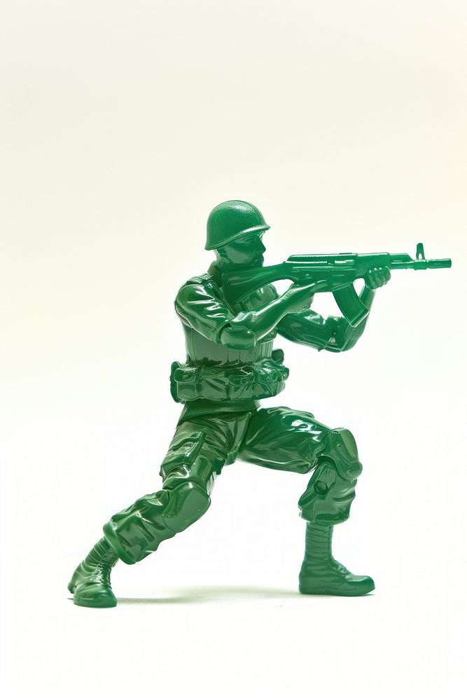Plastic toy soldier doing playing weaponry firearm person.