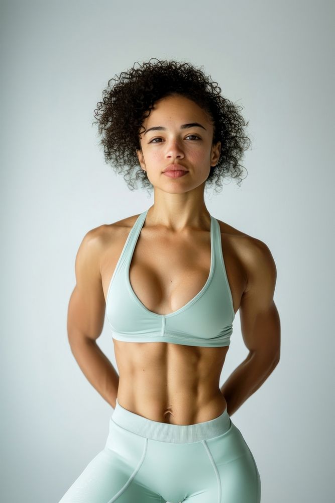 Athletic mixed race woman with six pack exercise apparel fitness.