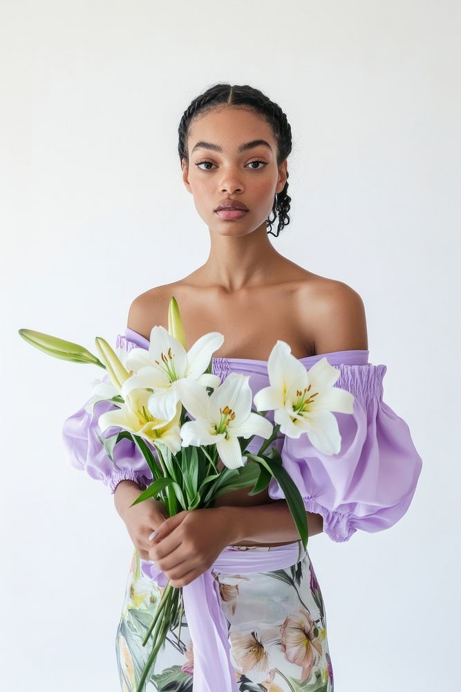 Woman in a pastel purple top and floral skirt background portrait bouquet.