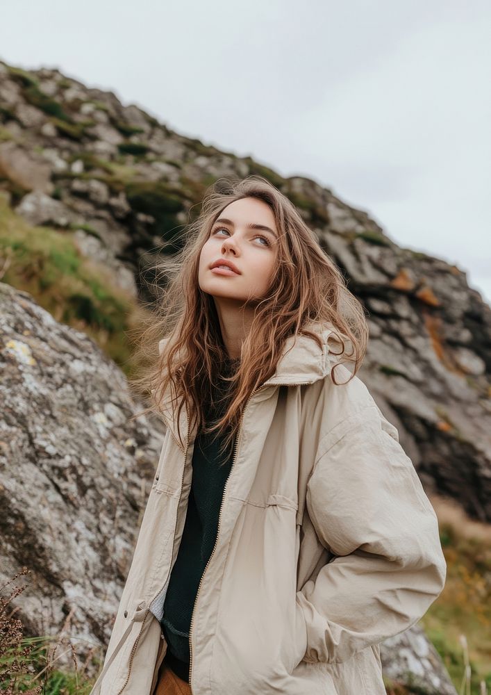 Wearing minimal beige oversize jacket woman nature hair.