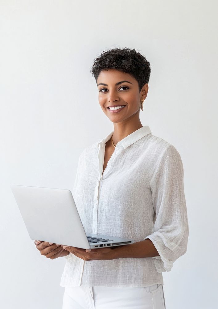 An indain woman wearing a shirt laptop background smile.