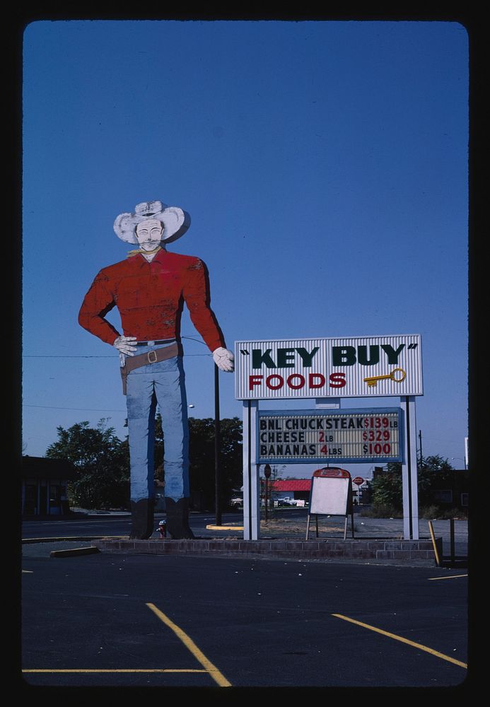 "Key Buy" Foods cowboy sign, Umatilla, Oregon (1987) photography in high resolution by John Margolies. Original from the…