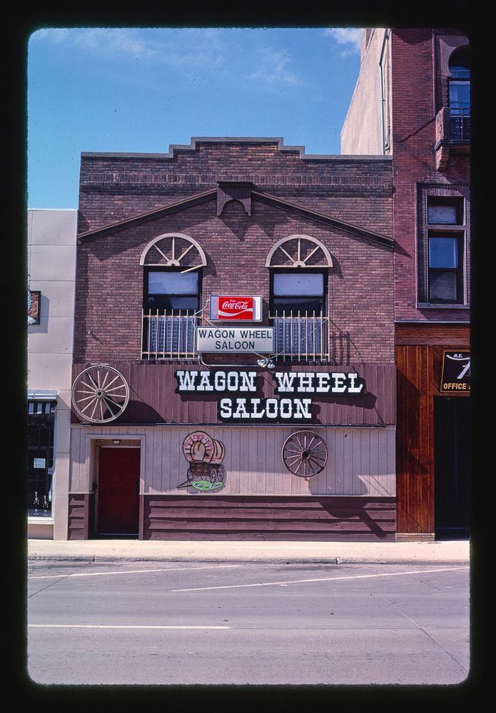 Wagon Wheel Saloon, Aberdeen, South Dakota (1987) photography in high resolution by John Margolies. Original from the…