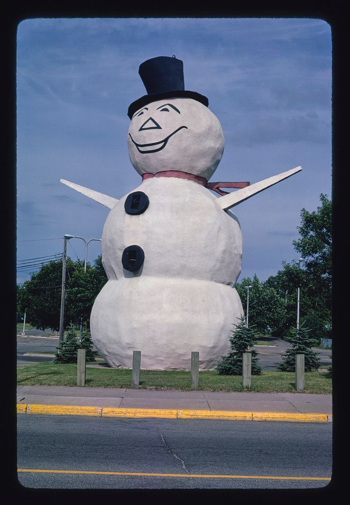 Snowman statue, angle 2, Margaret Street, North St. Paul, Minnesota (1984) photography in high resolution by John Margolies.…