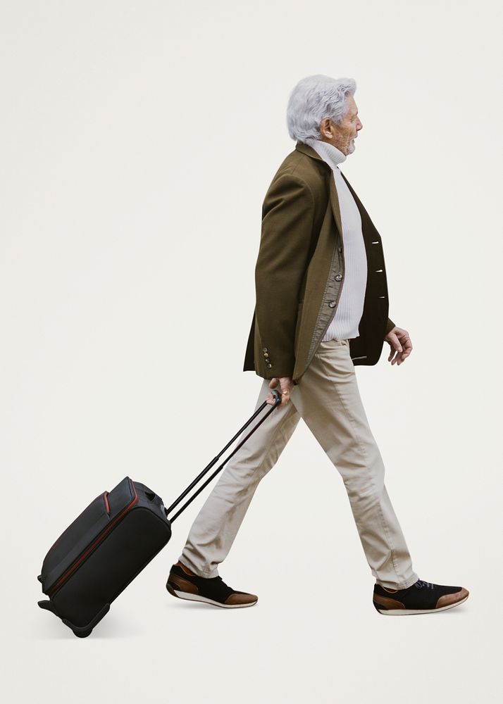 Senior tourist with suitcase, isolated on blue psd