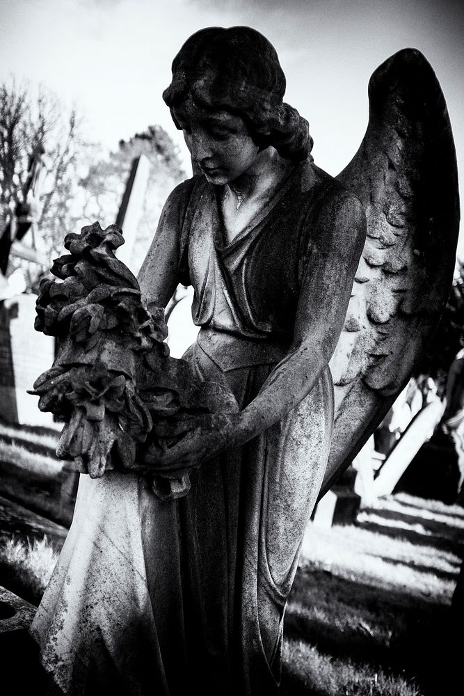 Angel statue in black and white. Original public domain image from Flickr