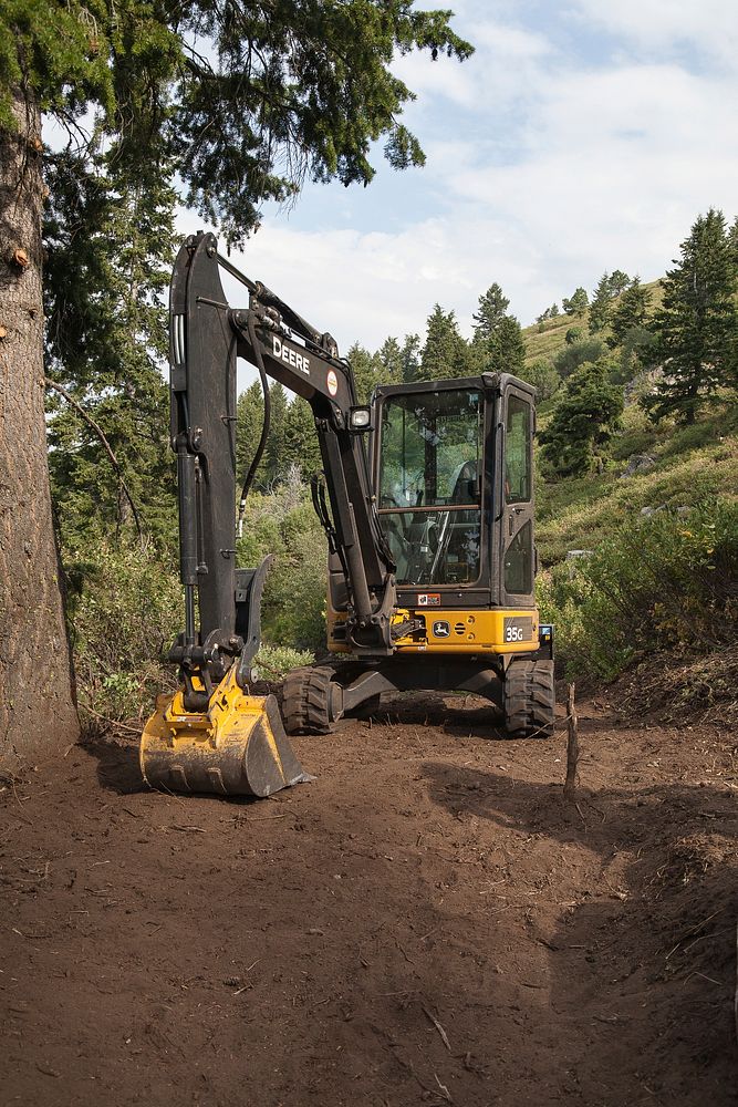 Backhoe, A backhoe was used to remove the majority of the greenery. Idaho Conservation Crew Building a Mountain Bike Flow…