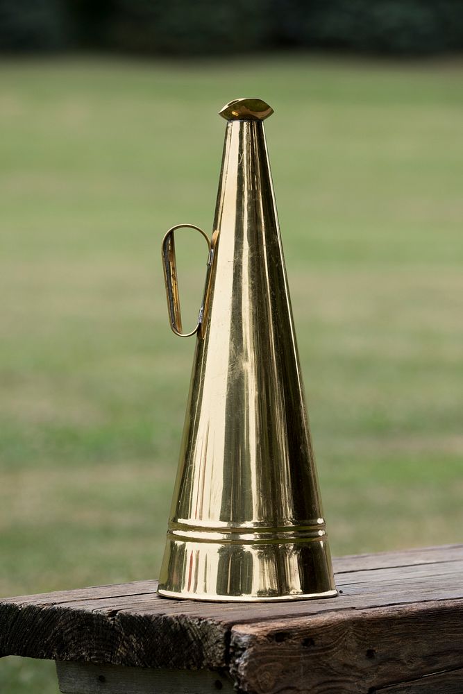 A megaphone stands ready to help the umpire call out to the outfield during a historic baseball game being played where…