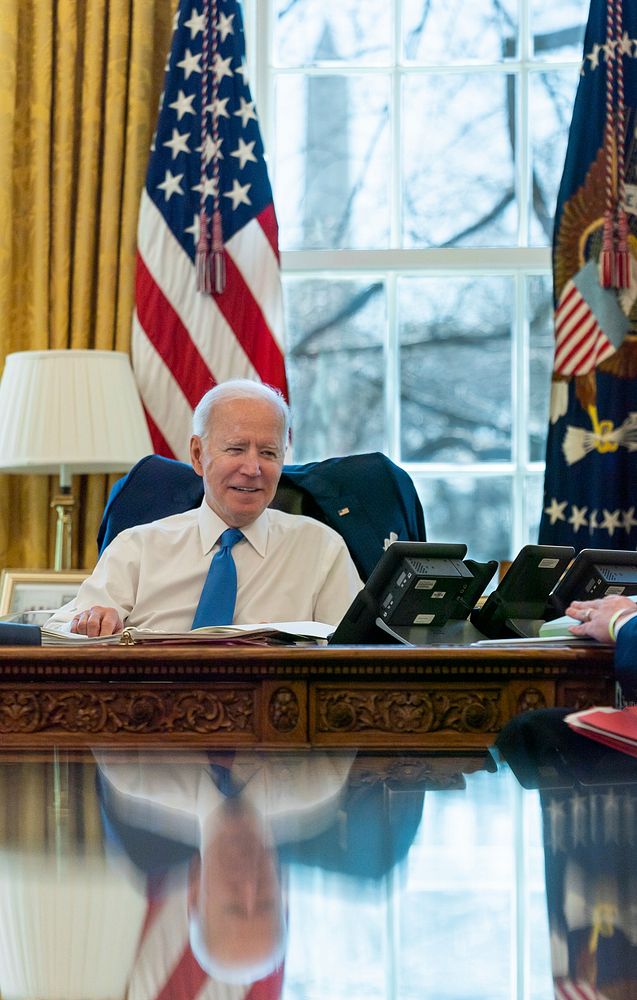 President Joe Biden talks on the phone with British Prime Minister Boris Johnson Friday, March 26, 2021, in the Oval Office…