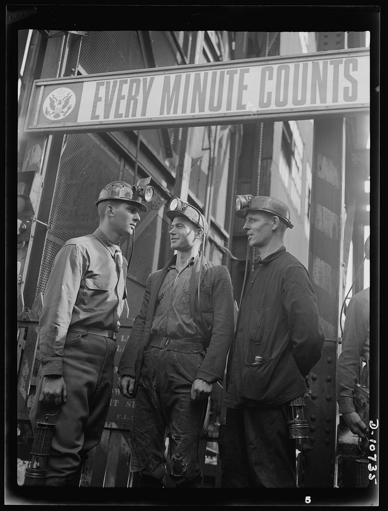 War production drive. Anthracite rallies. A soldier wears a miners' cap and lamp before he descends the shaft into the mine.…