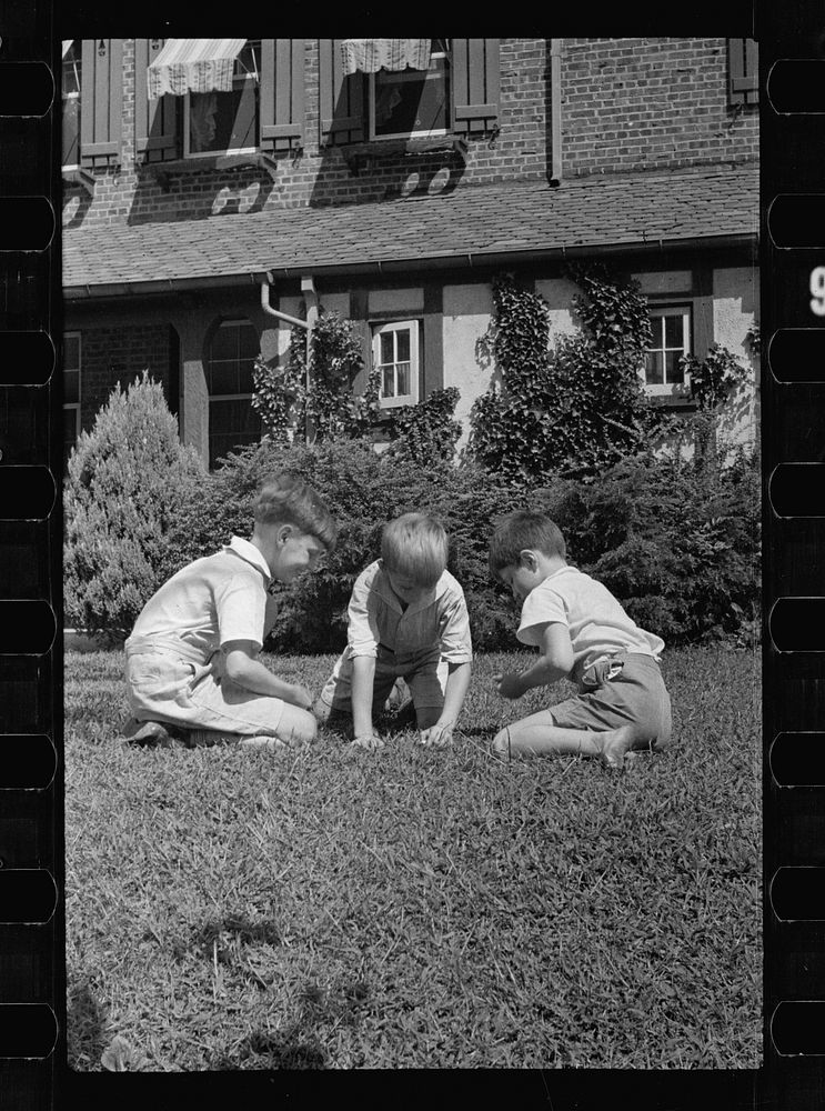 Healthy children at play on the front lawn of one of Washington's better housing sections. These houses have both sweeping…