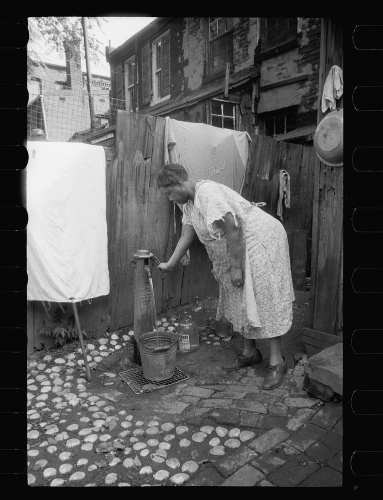 Outside water supply, Washington, D.C. Only source of water supply winter and summer for many houses in slum areas. In some…