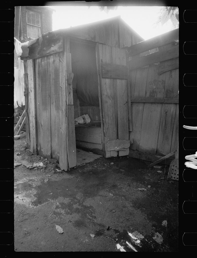 [Untitled photo, possibly related to: Slum backyard water supply, Washington, D.C. Backyard typical to a group of houses…