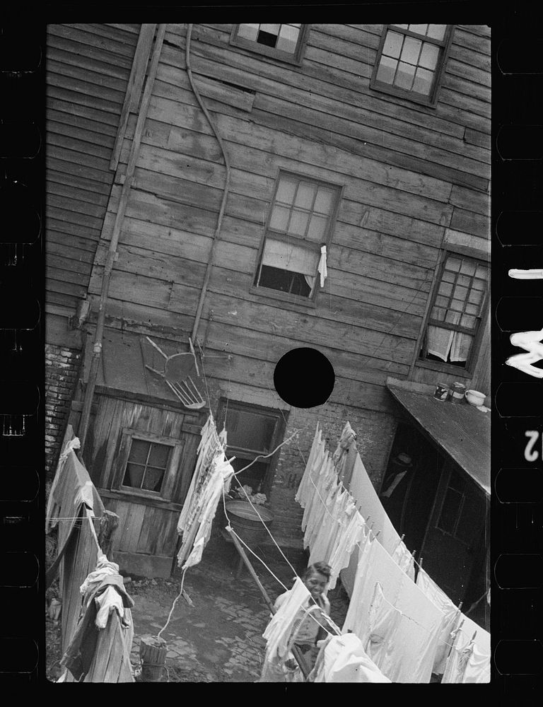 [Untitled photo, possibly related to: Typical slum area. Note dome of Capitol, Washington, D.C.]. Sourced from the Library…
