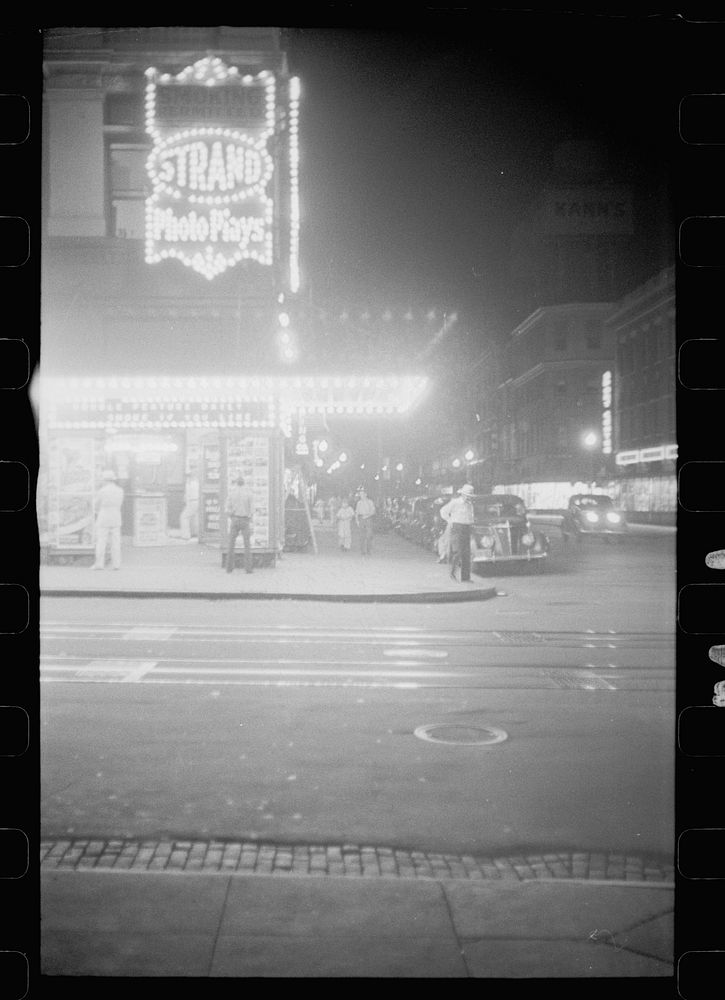Putting up movie posters at night, Washington, D.C.. Sourced from the Library of Congress.