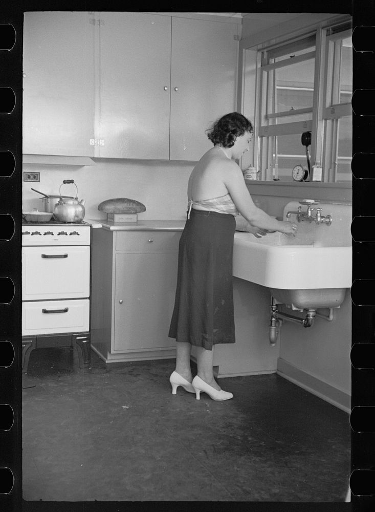 [Untitled photo, possibly related to: Hightstown homesteader in the kitchen of her new home, New Jersey]. Sourced from the…