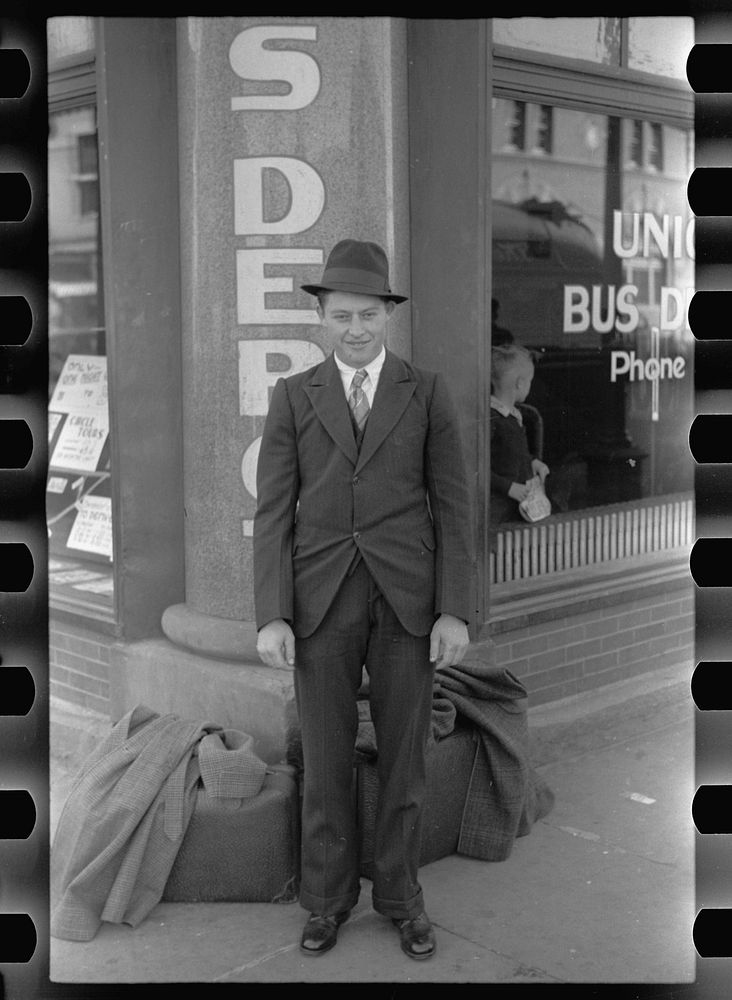 Boy in front of the bus depot. Grand Island, Nebraska. Sourced from the Library of Congress.