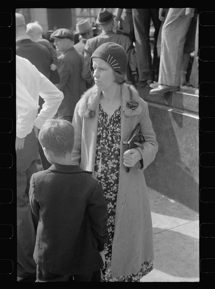 Woman and son downtown at the parade, Cincinnati, Ohio. Sourced from the Library of Congress.